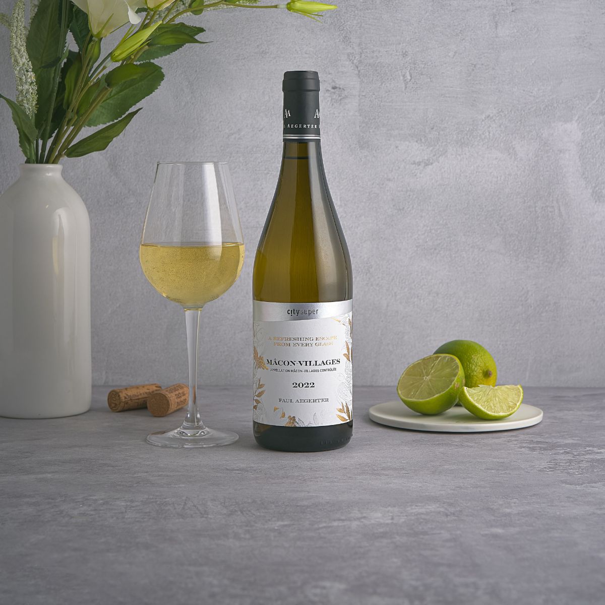 2022 Macon Villages white wine bottle with stem glass of white wine