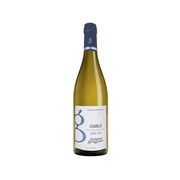 Chablis white wine bottle with dark blue cap and pale straw glass