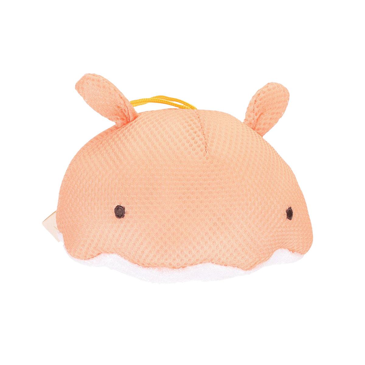 Peach octopus body sponge with stitched eyes and small ear fins