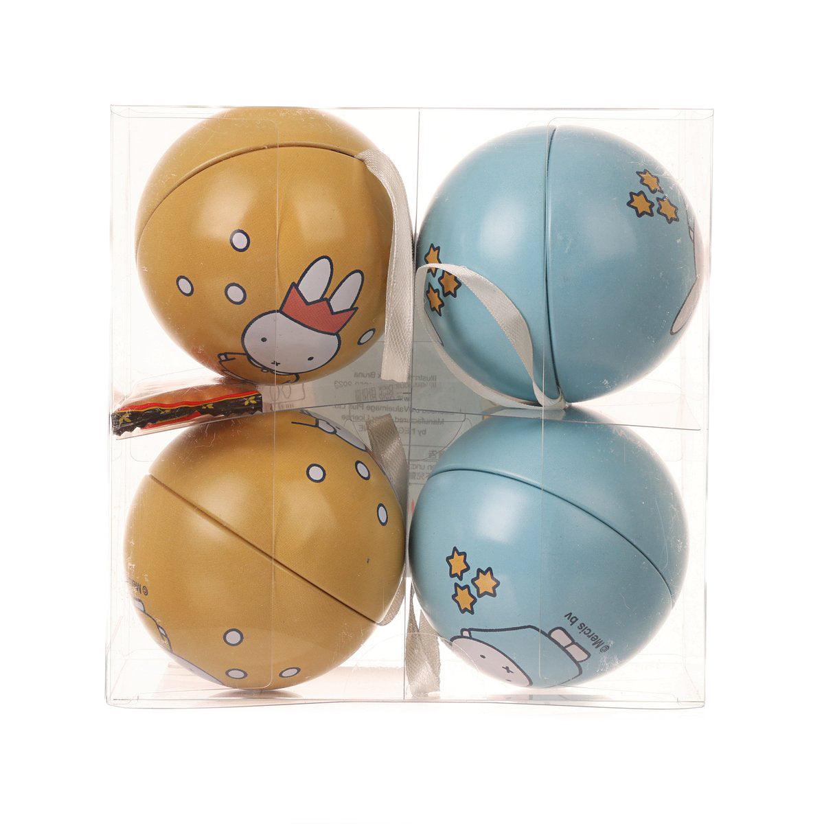 Set of four Miffy tin balls: two blue, two tan, with bunny and star graphics