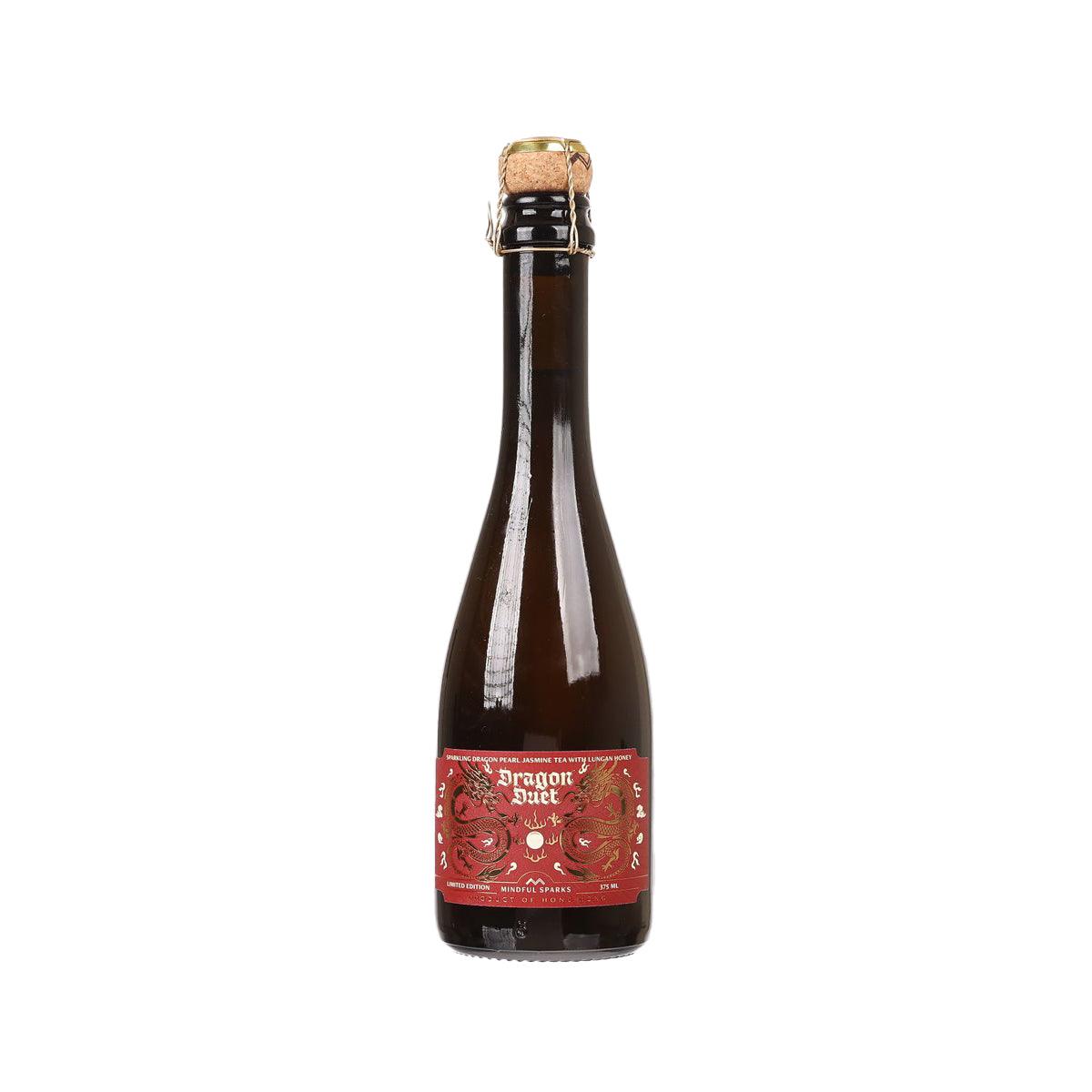 Sparkling tea bottle, dark amber glass with front red label and cork cap