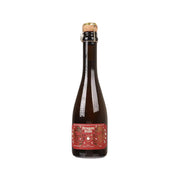 Sparkling tea bottle, dark amber glass with front red label and cork cap