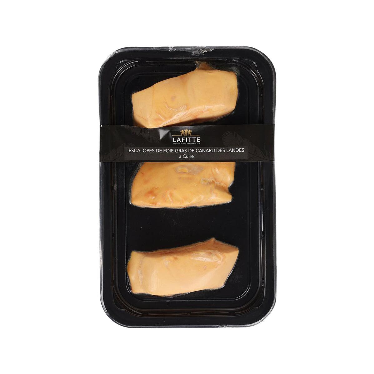 Chilled duck foie gras portions in black tray with three sealed slices