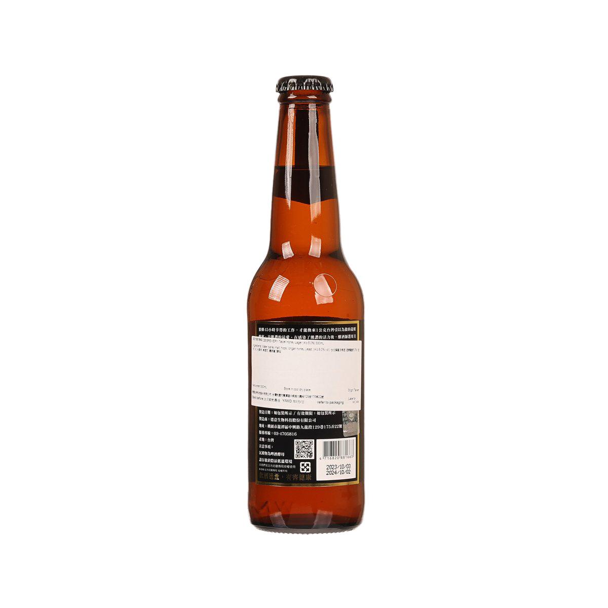 Amber beer bottle with back label and barcode, black cap