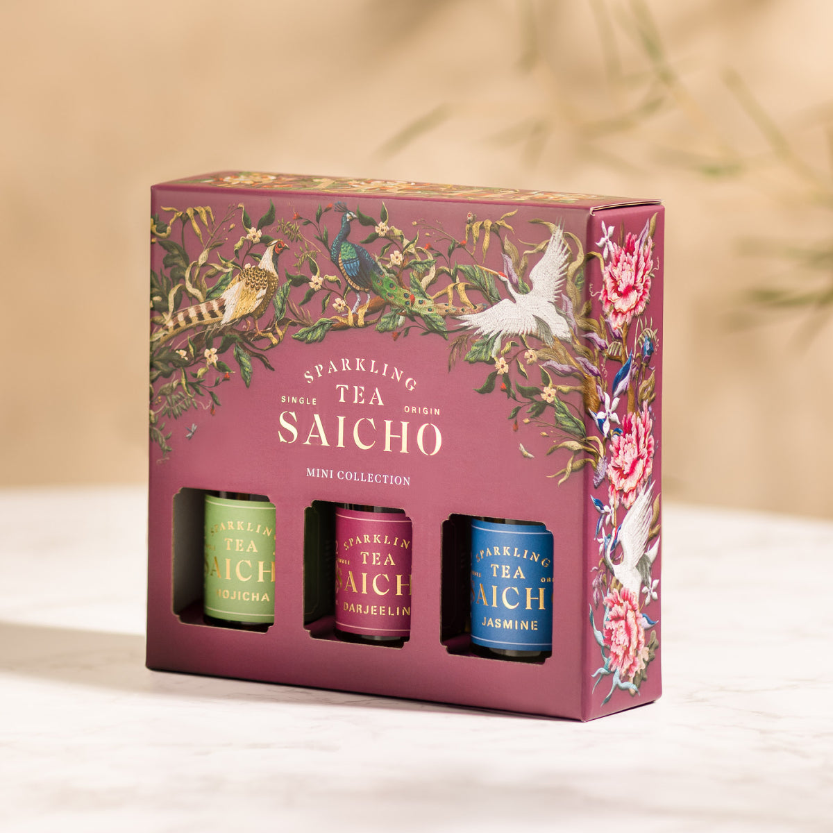 Sparkling tea mini collection box, front panel with three colorful tea tins