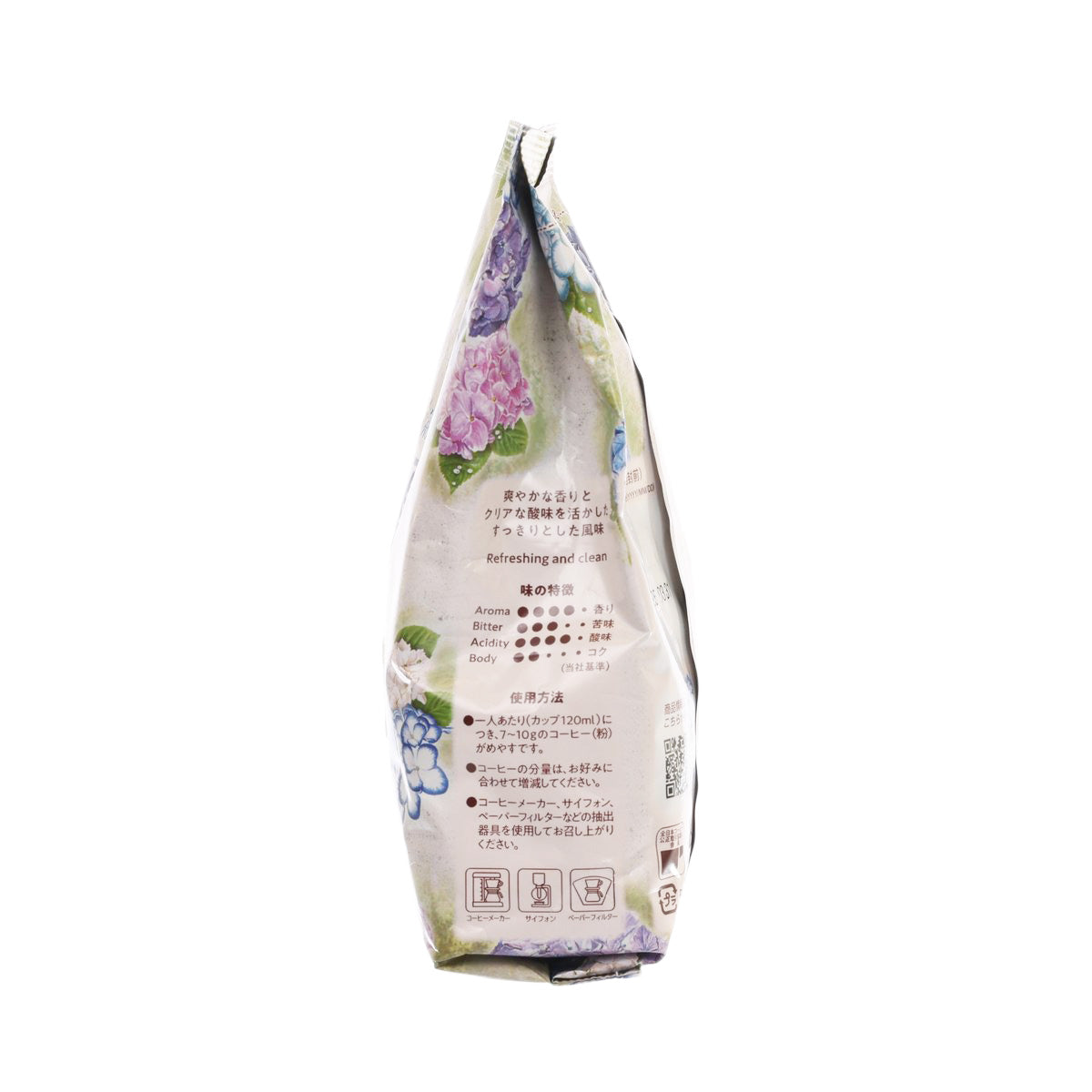 Ground coffee bag, angled back view with floral design and printed product details