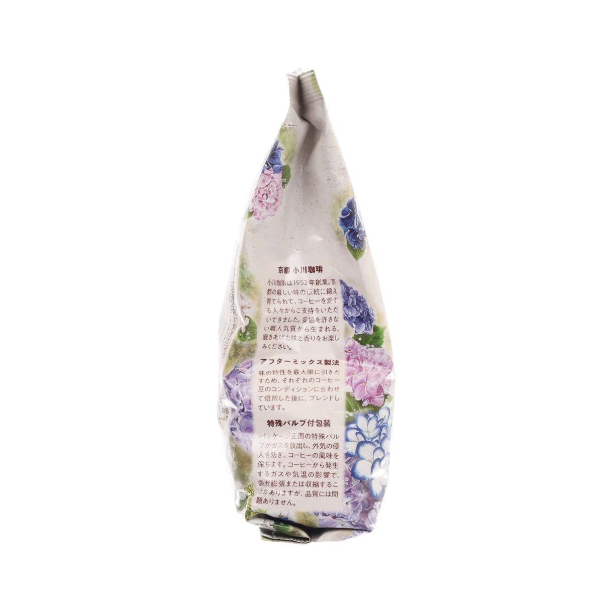 Ground coffee bag, side view with floral pattern and small printed information