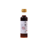 Koji soy sauce bottle with gold cap and front label, dark amber liquid
