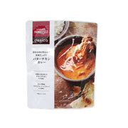 Butter chicken curry pouch with printed label and chicken curry bowl photo