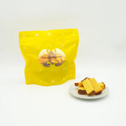 FUKUSAYA Bizcocho 100g yellow pouch with small cake cubes on white plate