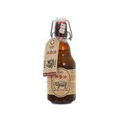 Amber lard cooking oil in swing-top glass bottle with front label and red seal