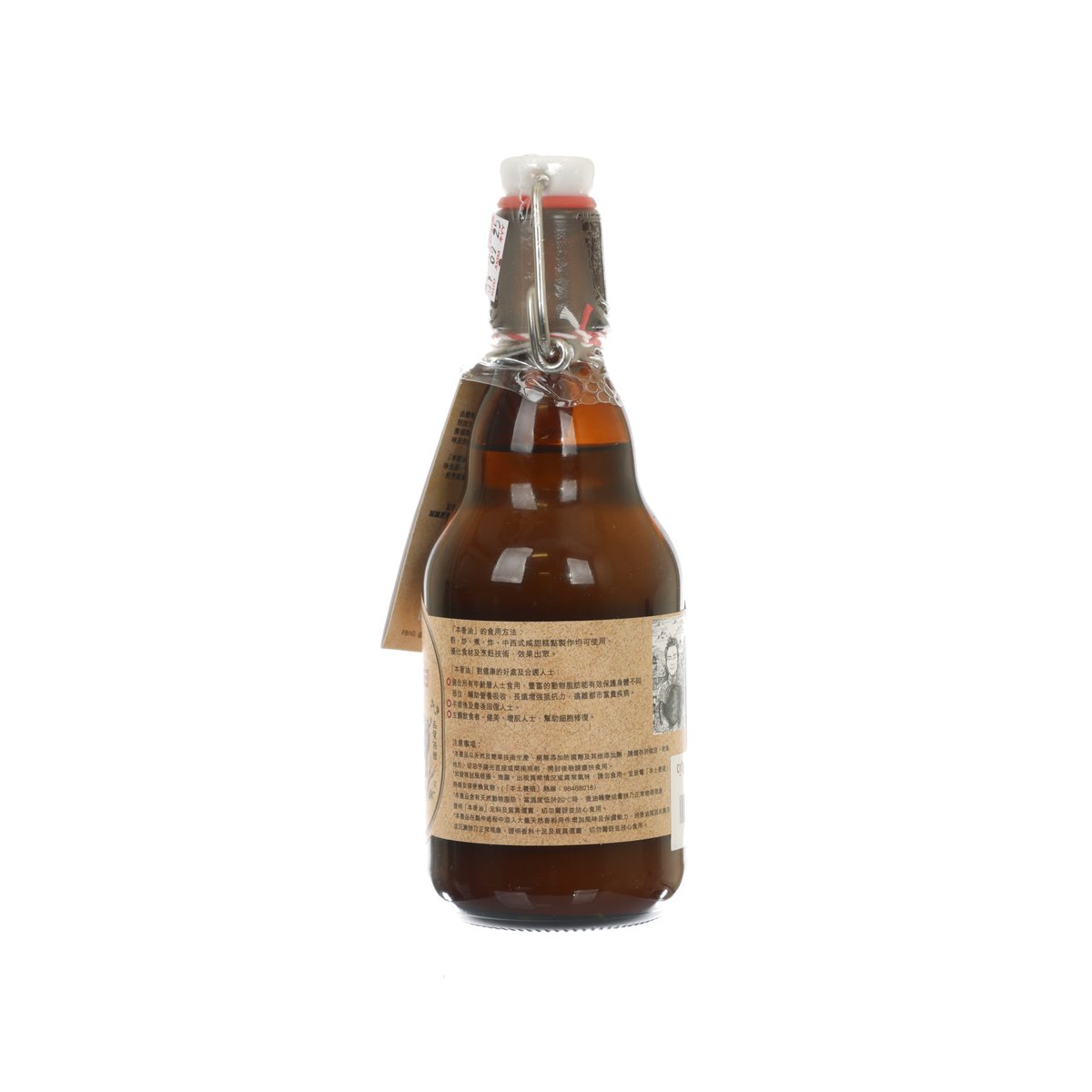 Amber cooking oil in swing-top glass bottle, back label and hinged metal clamp
