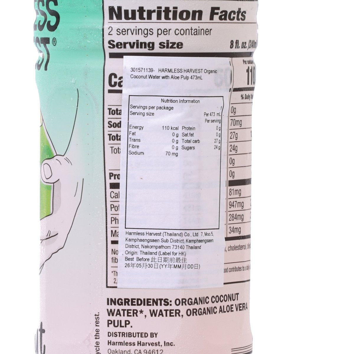 Nutrition Facts panel close-up on organic coconut water bottle with aloe pulp