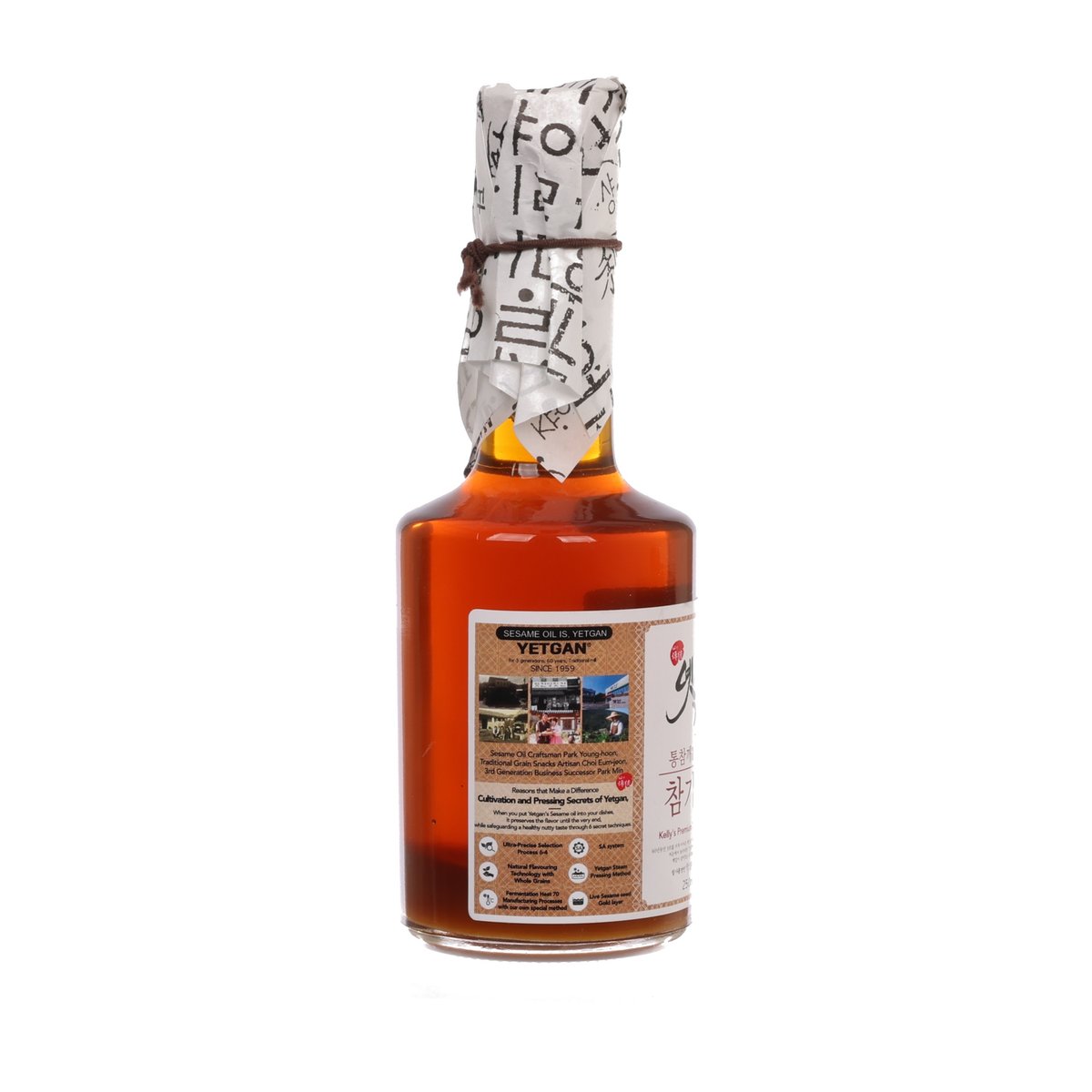 Premium sesame oil bottle, front label with icons and brown amber contents
