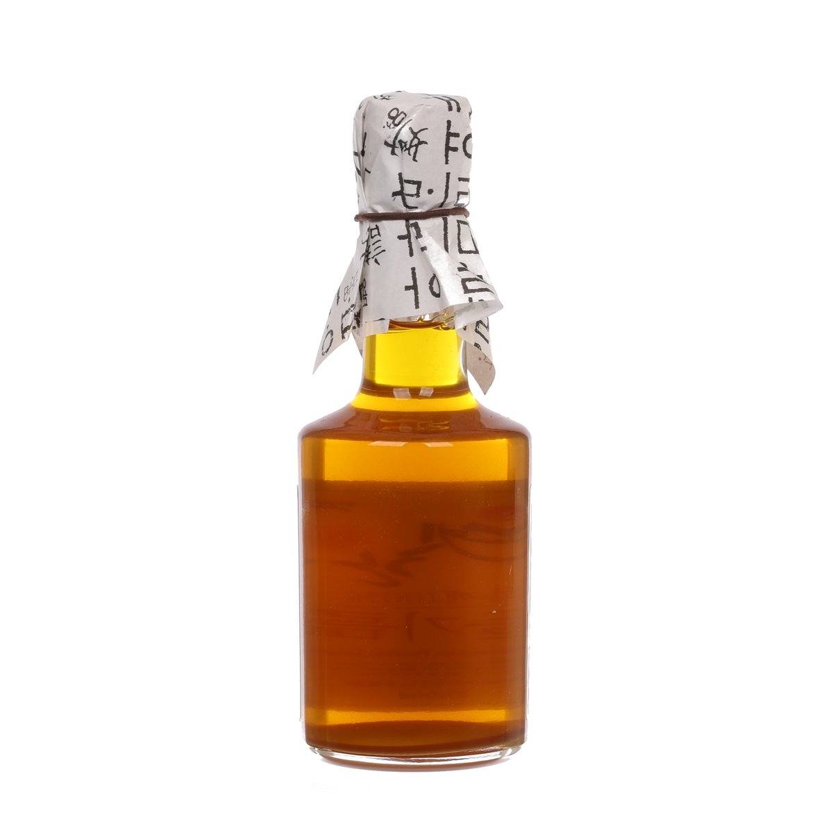 YETGAN perilla seed oil bottle, amber glass with yellow liquid and foil-wrapped cap