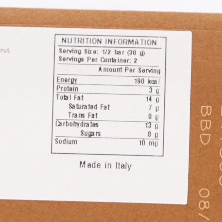 Chocolate bar nutrition facts panel on wrapper showing serving size and calories