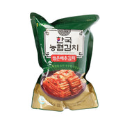 Korean napa cabbage kimchi pouch, green package with front label and red kimchi