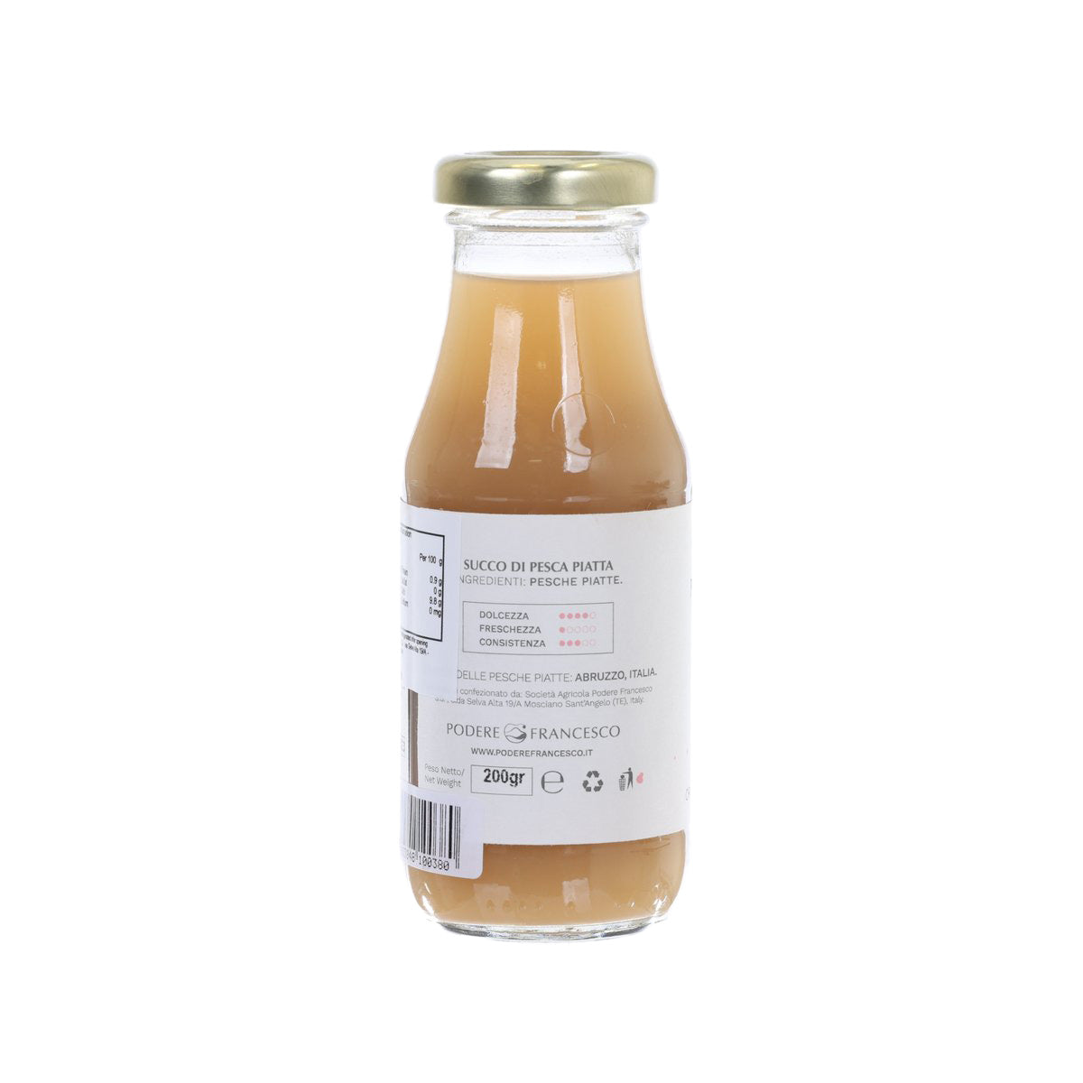 Bottled peach juice glass bottle with gold cap, label shows ingredients and 200 g