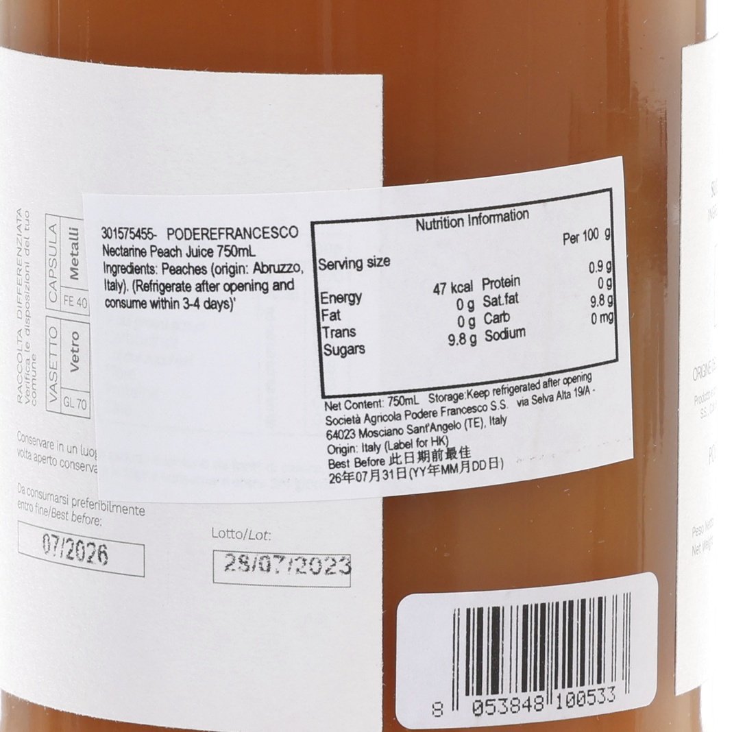 Nectarine peach juice bottle label close-up with nutrition facts and barcode