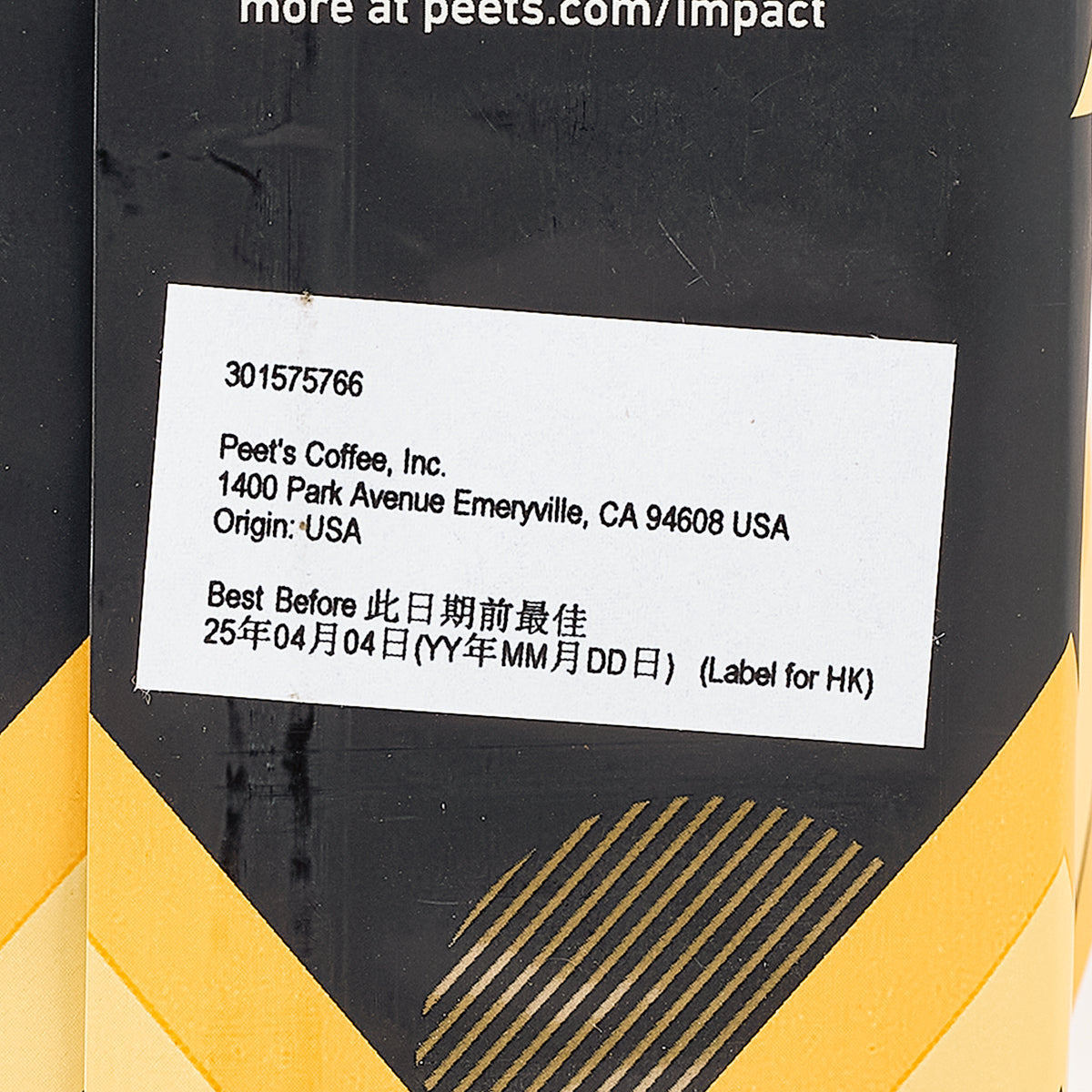 Coffee bag label close-up with origin and best before date, black and yellow