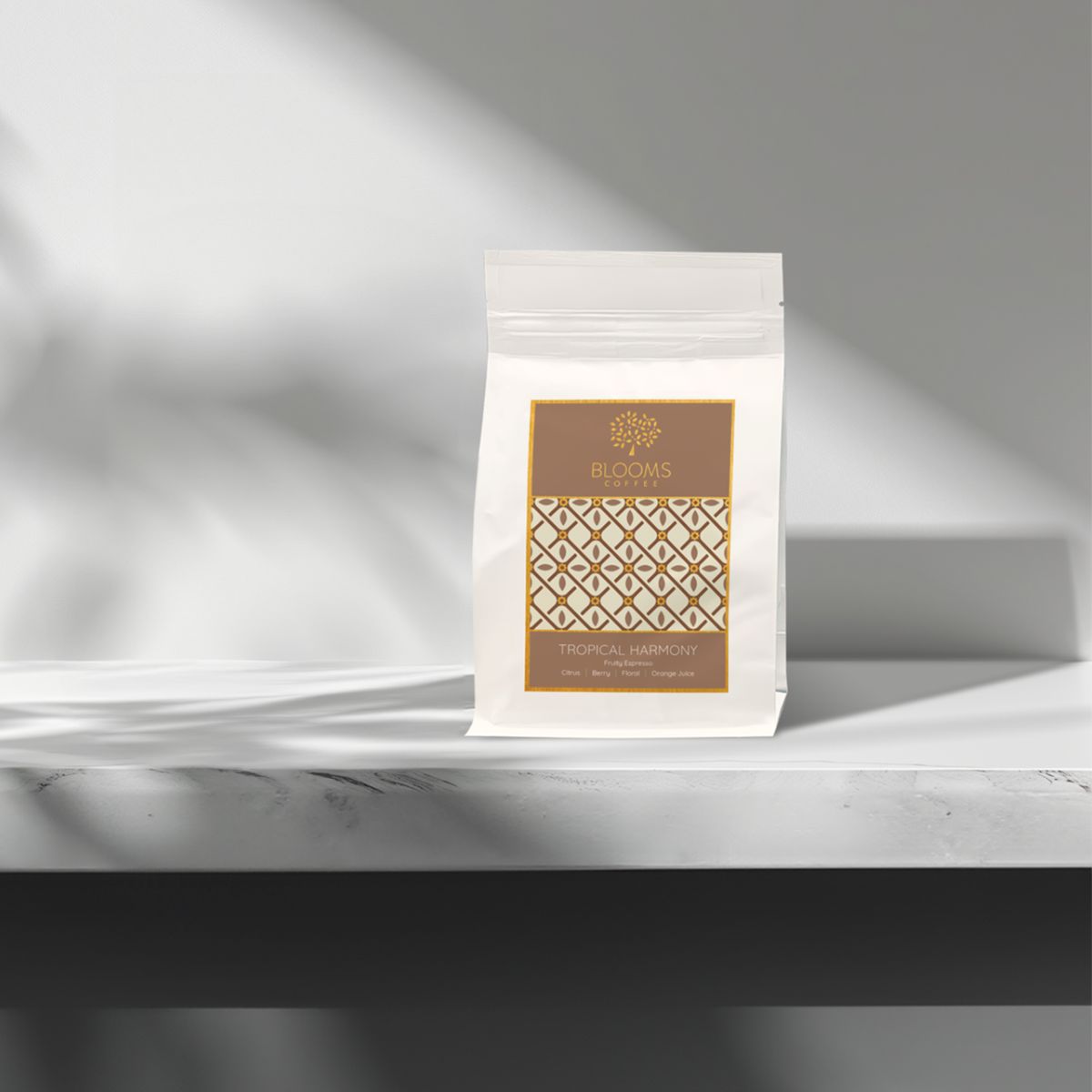 Coffee bean bag standing on a shelf, Tropical Harmony label on white pouch.