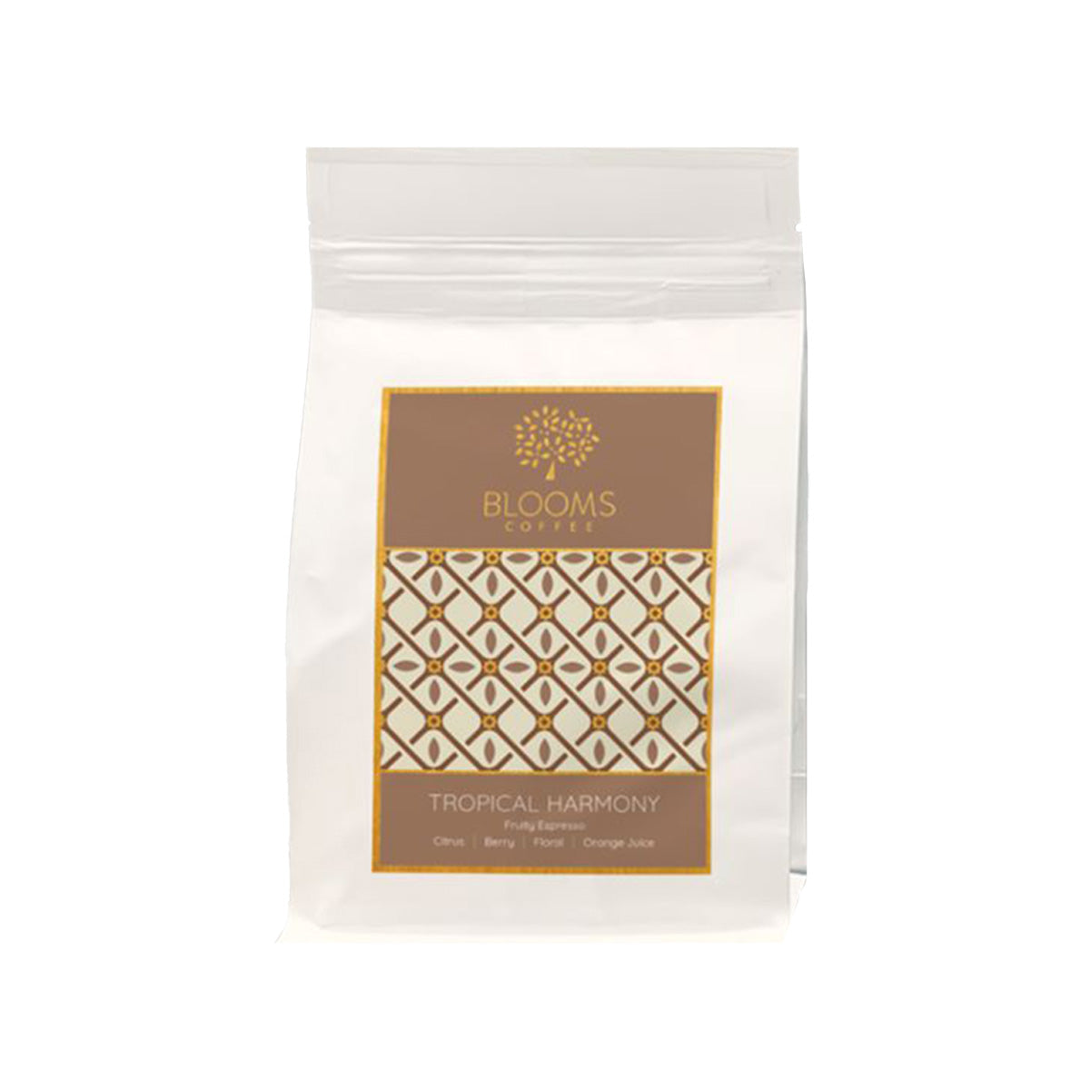 Coffee bean bag with Tropical Harmony label, white resealable pouch and gold design.