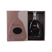 Hennessy James Hennessy cognac bottle in open gift box with amber glass
