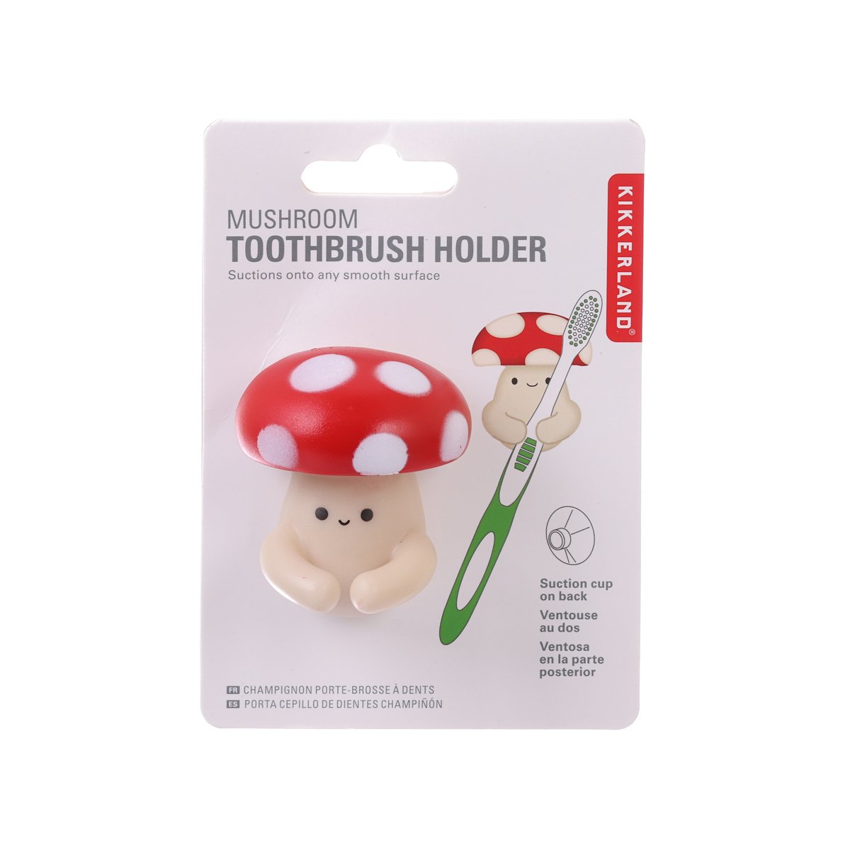 Red mushroom toothbrush holder with suction base, polka-dot cap, for sink mounting.