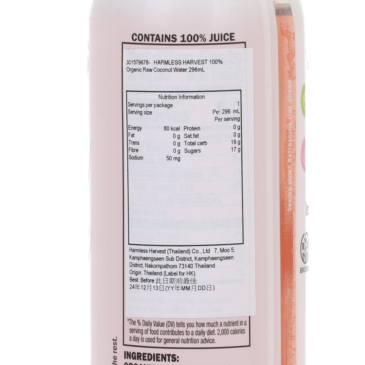 Organic raw coconut water nutrition facts label on bottle, green cap edge