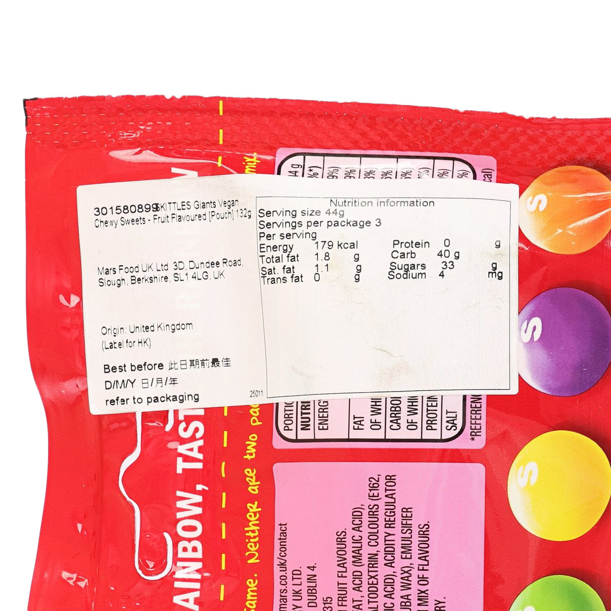 Red sweets pouch close-up with nutrition facts, ingredients text, and serving info