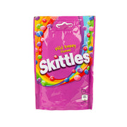 Skittles wild berry vegan chewy sweets pouch, purple package with candy graphics