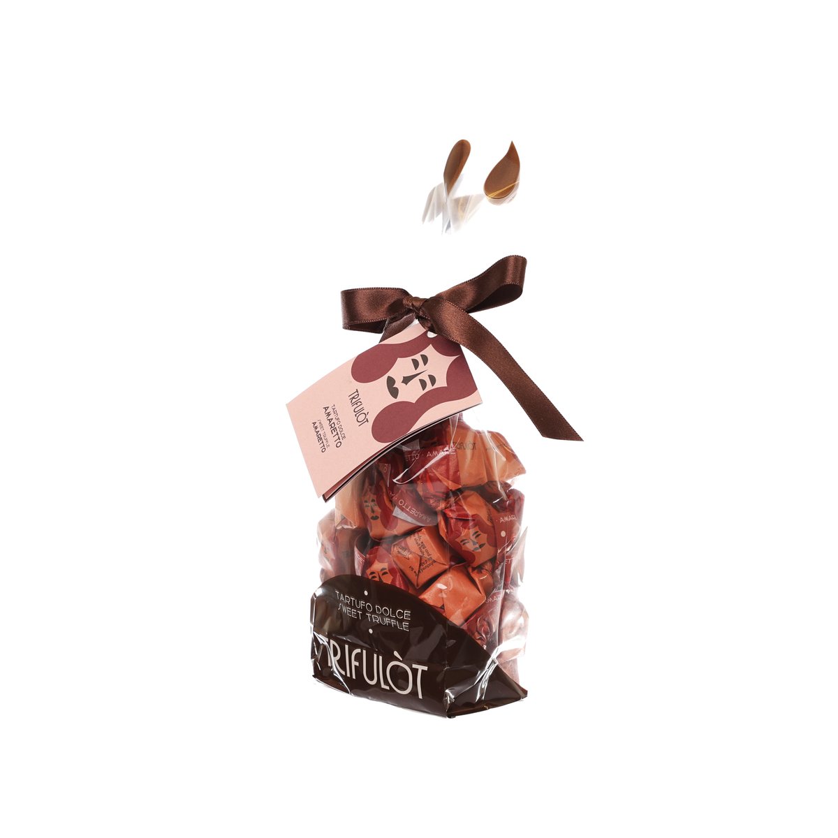 Chocolate truffle bag with brown ribbon and hanging tag over dark pralines