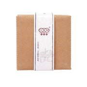 Stone ground chili sauce carton, brown kraft with white label band.