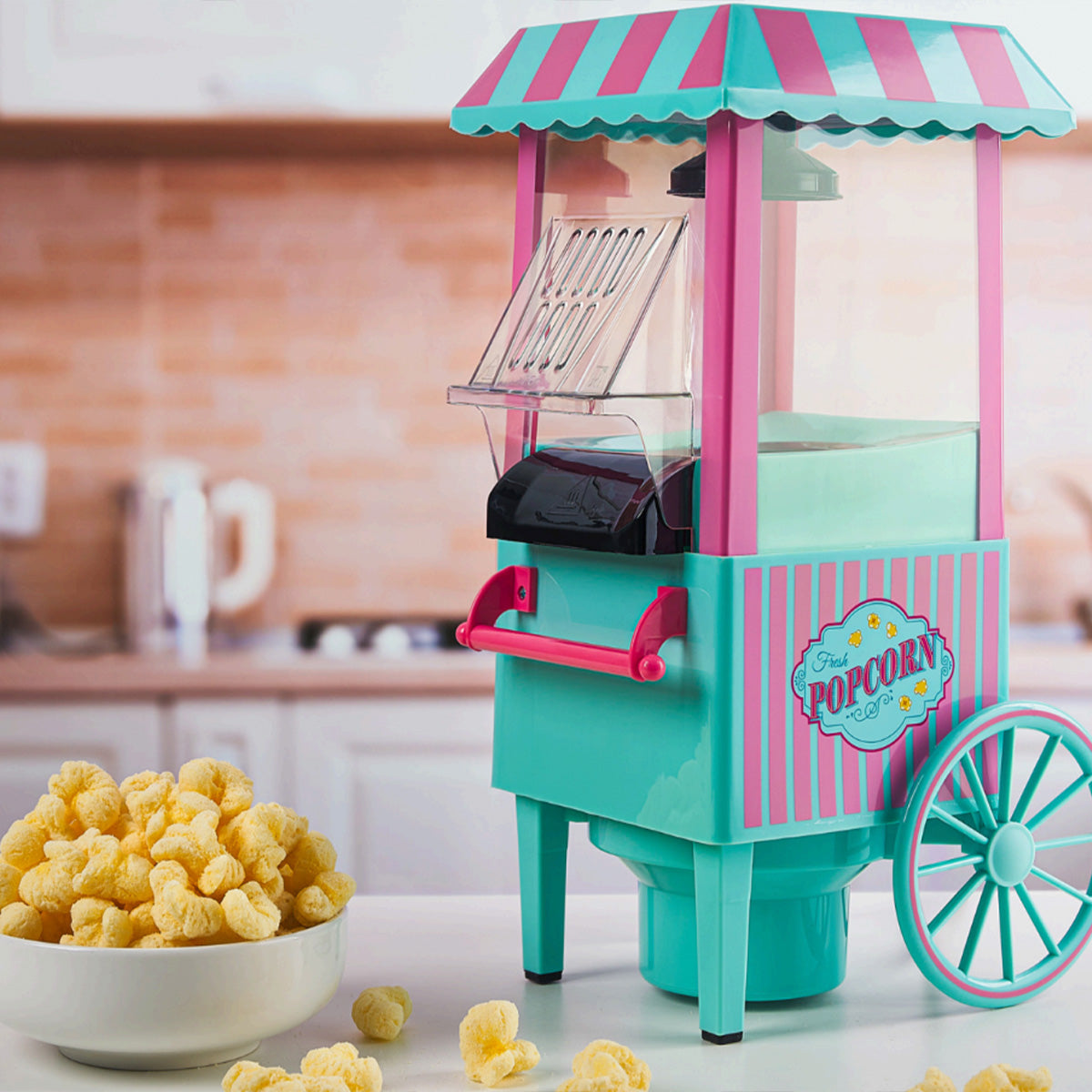 Mini popcorn maker cart in teal and pink with striped awning, chute, and wheel