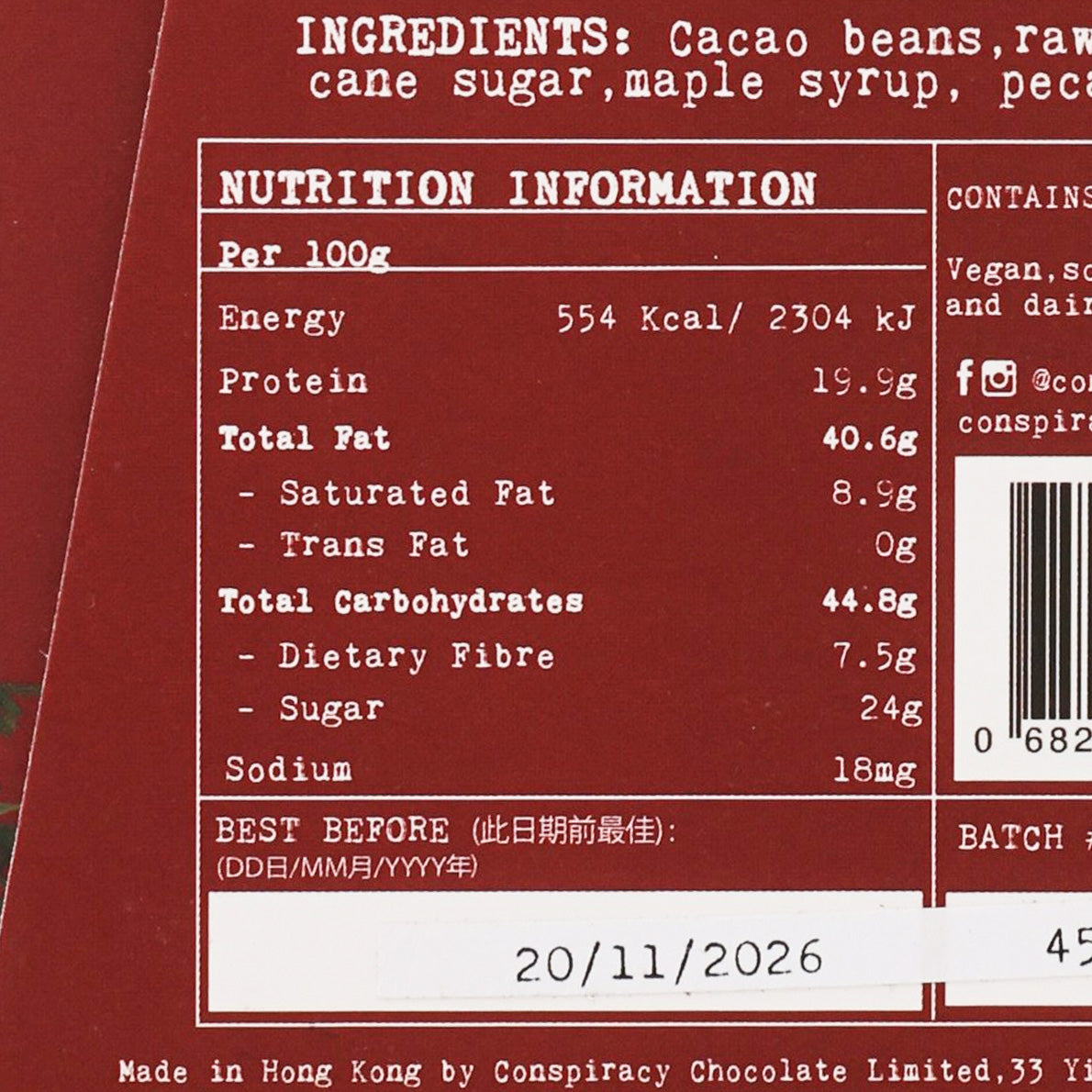 Close-up of chocolate bar nutrition facts and ingredients panel on dark packaging