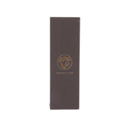 Dark brown cookie box with gold logo emblem