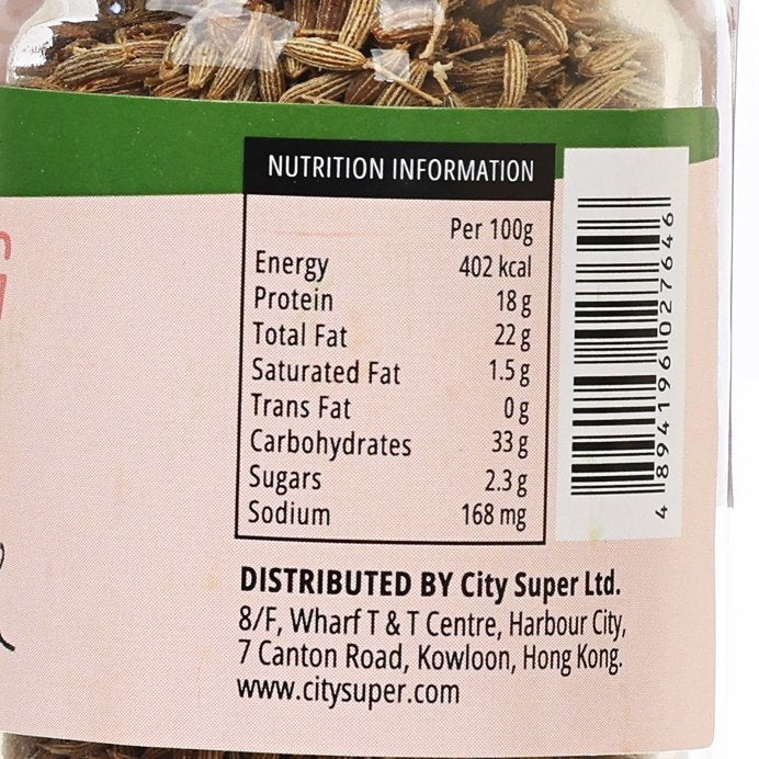 Close-up of nutrition information label on cumin seed jar