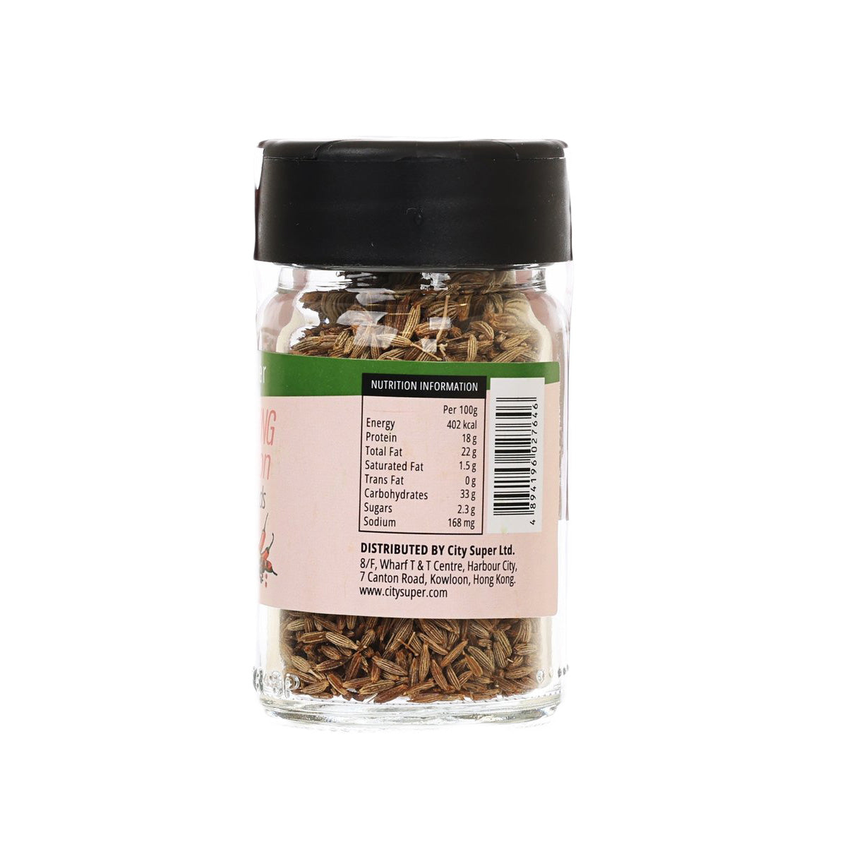 Glass jar of cumin seeds with black cap and nutrition label on back