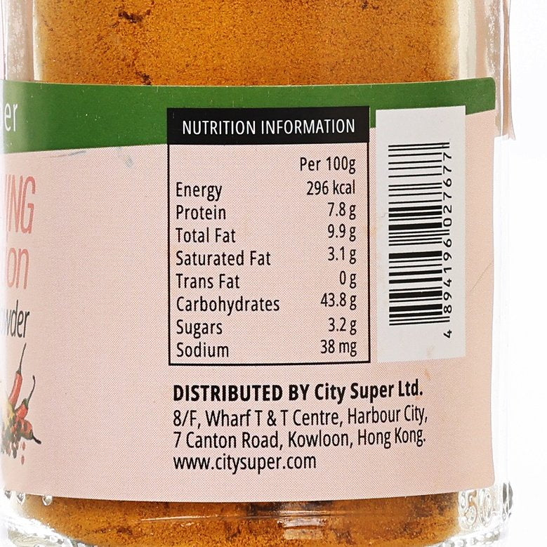 Close-up turmeric powder label with nutrition information per 100g