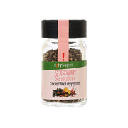 Cracked black peppercorns jar with black lid and front seasoning label