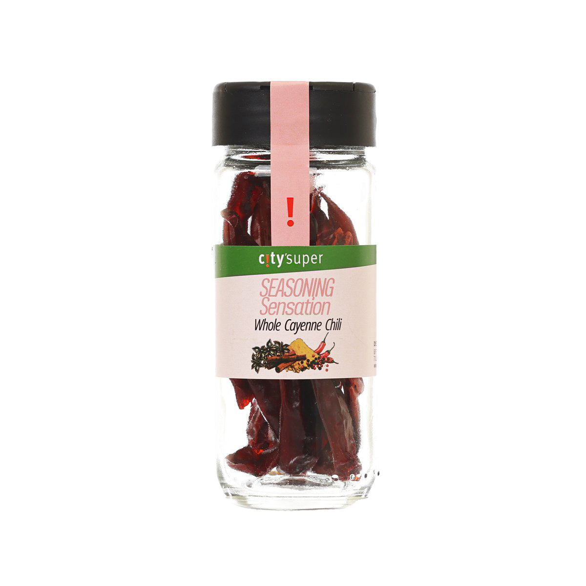 Whole cayenne chili in glass bottle with black cap, dried red pepper pieces