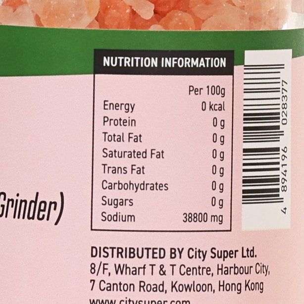 Nutrition information label with barcode on pink Himalayan rock salt grinder jar