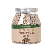 Jar of black-eyed beans with silver lid and green label, clear container of beige beans
