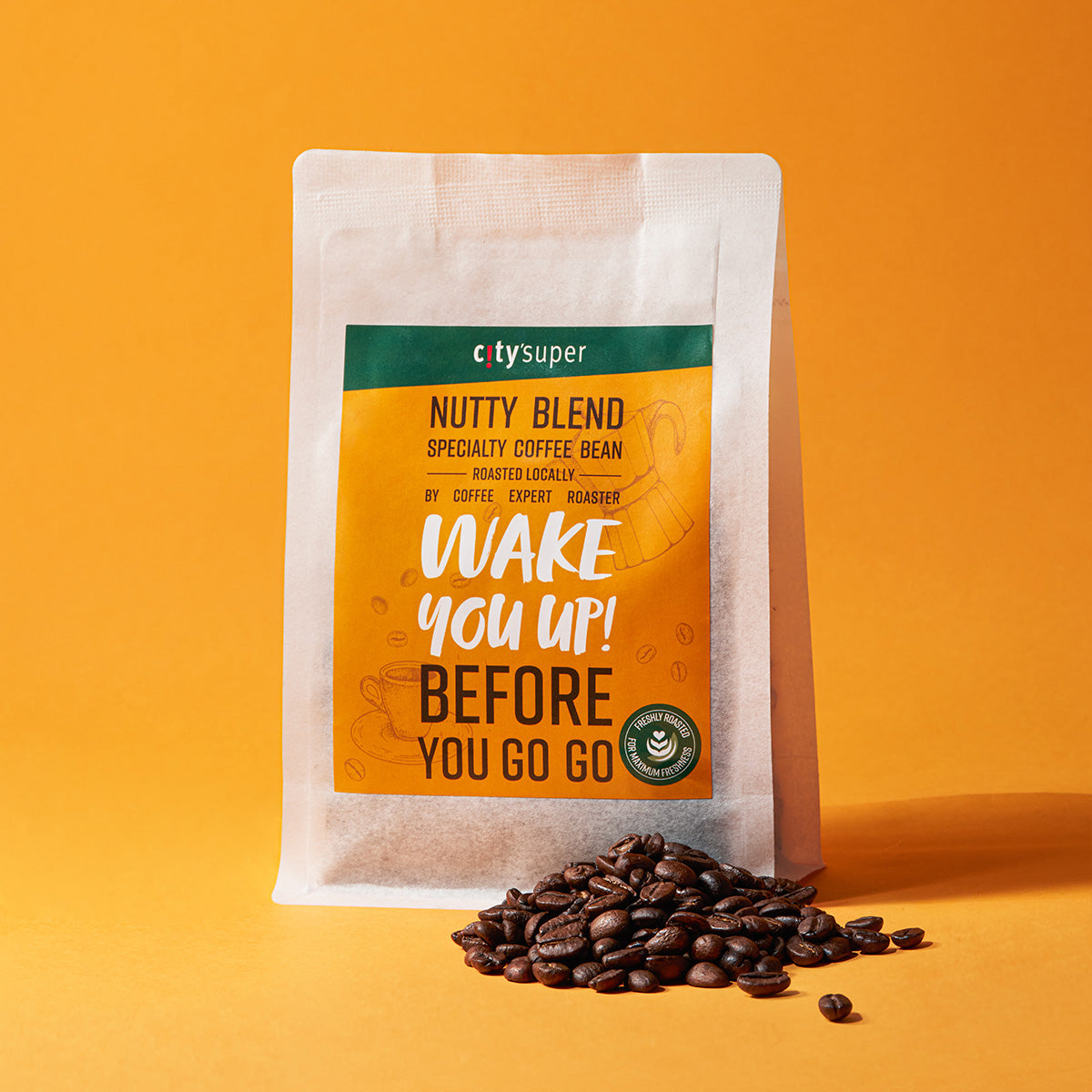 Coffee bean pouch with whole roasted beans scattered in front