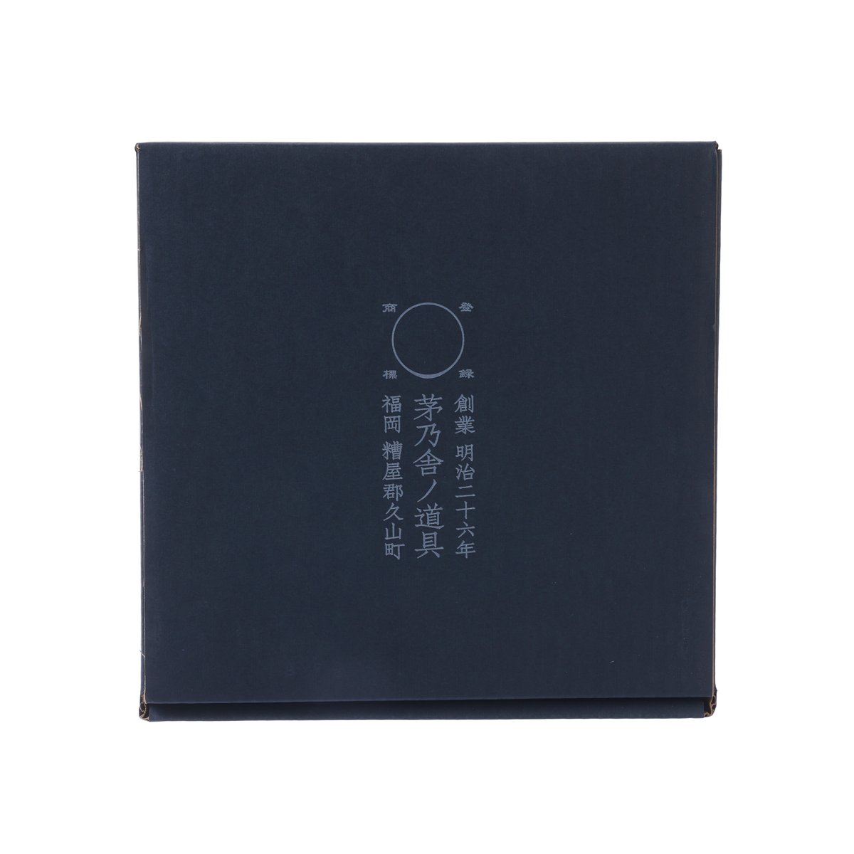 Dark blue product box with circular logo and vertical character text