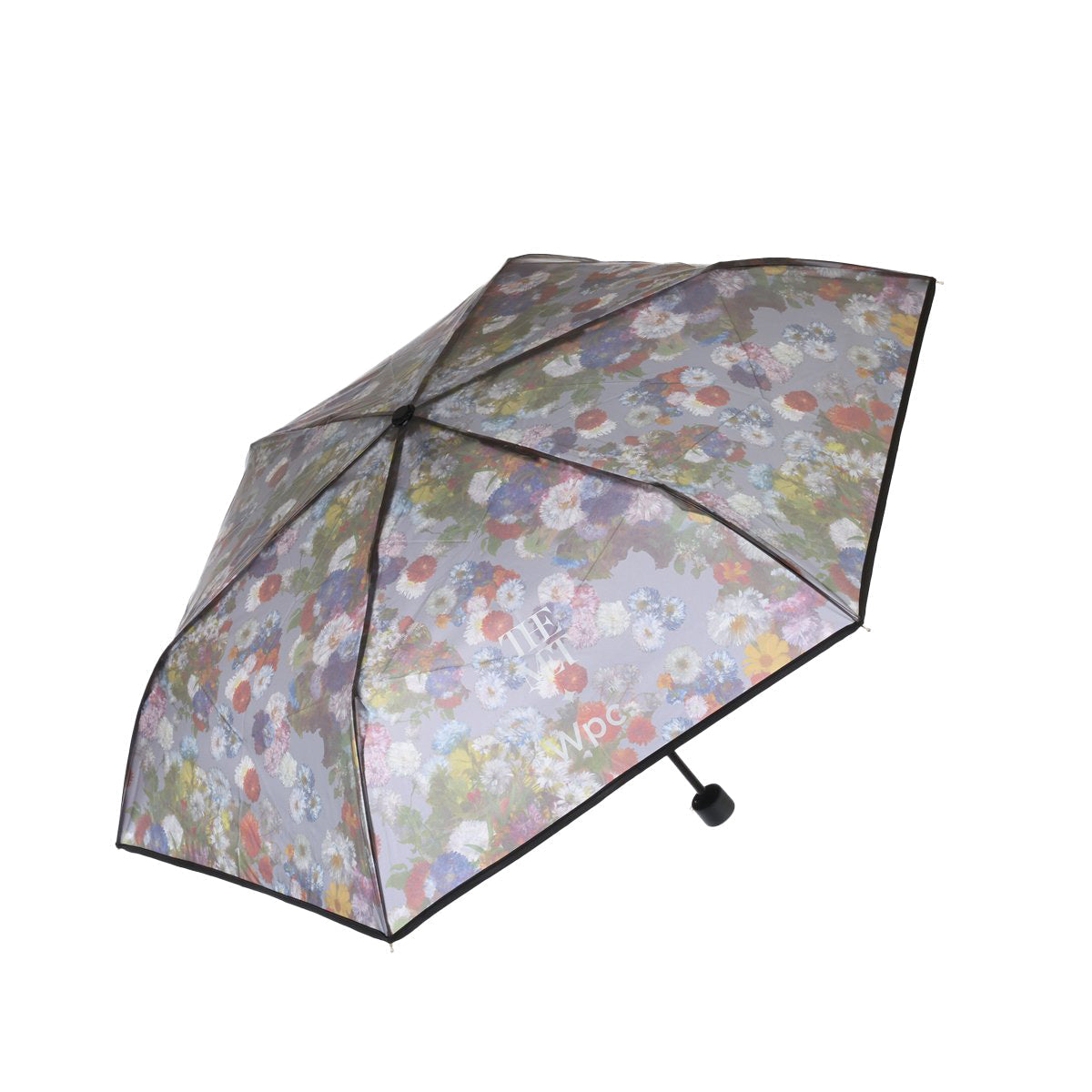 W.P.C. compact umbrella with multicolor floral print and black handle