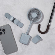 Portable slim grip fan with circular head, strap handle, and hook attachment