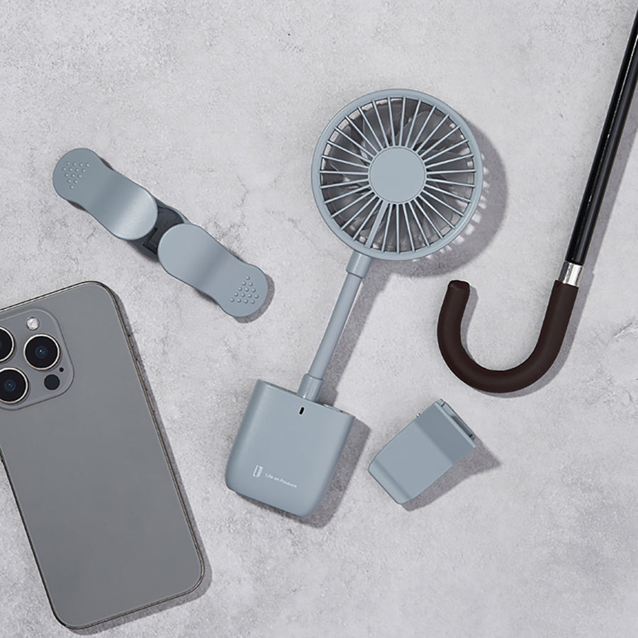 Portable slim grip fan with circular head, strap handle, and hook attachment