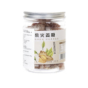 Handmade ginger candy jar with clear plastic lid, brown shredded candy inside