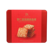 Red cookie tin with stacked almond crunch cookies on front label